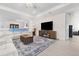 Bright living room with a large TV, comfortable seating, and elegant decor at 2137 Raglan Cir, Ormond Beach, FL 32174