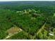 Aerial view showing a large lot including the main house and the mother in law house at 21375 Nw 150Th Avenue Rd, Micanopy, FL 32667