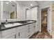 Bathroom with double sinks, vanity, and walk-in closet at 21375 Nw 150Th Avenue Rd, Micanopy, FL 32667