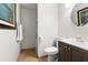 Traditional bathroom with tiled floor, framed artwork, and shower featuring patterned curtain at 21375 Nw 150Th Avenue Rd, Micanopy, FL 32667