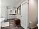 Bathroom featuring a vanity, mirrors, tub and walk in closet at 21375 Nw 150Th Avenue Rd, Micanopy, FL 32667
