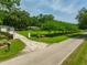 Property with a driveway, lush lawn, mature trees and landscaping, and a home in a private, serene setting at 21375 Nw 150Th Avenue Rd, Micanopy, FL 32667