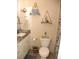 Cozy bathroom with decorative shelves, charming accents, and a neutral color palette at 39 Benjamin Dr, Ormond Beach, FL 32176