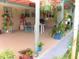 Spacious covered patio with vibrant decor, offering an inviting space for relaxation and outdoor entertainment at 39 Benjamin Dr, Ormond Beach, FL 32176