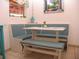 Eat-in dining nook with light-blue cushioned seating and a white table at 39 Benjamin Dr, Ormond Beach, FL 32176