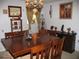 Dining room with a large wood table, seating for six, and decorative wall art at 39 Benjamin Dr, Ormond Beach, FL 32176