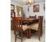 Dining room features an ornate chandelier, hardwood table and seating for six at 39 Benjamin Dr, Ormond Beach, FL 32176