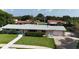 Well-maintained single-story home with a spacious front yard, lush landscaping, and a welcoming driveway at 39 Benjamin Dr, Ormond Beach, FL 32176