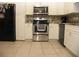 Updated kitchen featuring stainless steel appliances, white cabinets, and a stylish backsplash at 39 Benjamin Dr, Ormond Beach, FL 32176