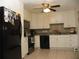 Bright kitchen featuring white cabinets, stainless steel appliances, and a tile backsplash at 39 Benjamin Dr, Ormond Beach, FL 32176