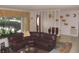 Inviting living room featuring a leather sectional sofa and unique decorative room divider at 39 Benjamin Dr, Ormond Beach, FL 32176