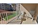 Balcony with lounge chairs overlooking the ocean at 4155 S Atlantic Ave # 204, New Smyrna Beach, FL 32169