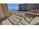 Balcony view of the ocean and pool with comfortable seating at 4155 S Atlantic Ave # 204, New Smyrna Beach, FL 32169