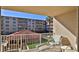 Balcony view of the resort grounds, pool, and ocean at 4155 S Atlantic Ave # 204, New Smyrna Beach, FL 32169