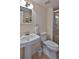 Cozy bathroom featuring a pedestal sink and enclosed shower at 4155 S Atlantic Ave # 204, New Smyrna Beach, FL 32169