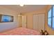 Inviting bedroom with closet space and warm lighting, perfect for rest and relaxation at 4155 S Atlantic Ave # 204, New Smyrna Beach, FL 32169