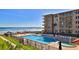 Condo features a sparkling pool, sundeck, and ocean views at 4155 S Atlantic Ave # 204, New Smyrna Beach, FL 32169