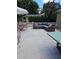 Relaxing backyard featuring patio furniture and green trees at 441 N Kentucky Ave, Deland, FL 32724