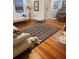 Inviting living room with natural lighting and hardwood floors at 441 N Kentucky Ave, Deland, FL 32724