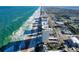 Wide aerial view along the beach, featuring beachfront condos and the expansive ocean at 89 S Atlantic Ave # 1004, Ormond Beach, FL 32176