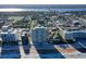 Stunning aerial view of beachfront condos, showcasing the beautiful beach and surrounding cityscape at 89 S Atlantic Ave # 1004, Ormond Beach, FL 32176