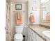 Neutral bathroom featuring decorative towels, vanity, and toilet at 89 S Atlantic Ave # 1004, Ormond Beach, FL 32176