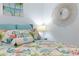 Bright bedroom with a large comfortable bed and decorative accents at 89 S Atlantic Ave # 1004, Ormond Beach, FL 32176