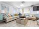 A comfortable lounge area featuring couches, accent tables and a view at 89 S Atlantic Ave # 1004, Ormond Beach, FL 32176