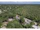 An aerial view of the property showing its location relative to the surrounding landscape and canal at 1108 Shockney Dr, Ormond Beach, FL 32174