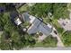 Aerial shot of a home showcasing a screened-in pool, dock, and well-manicured lawn at 1108 Shockney Dr, Ormond Beach, FL 32174