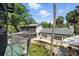 Aerial view of home with pool and lush landscaping at 1108 Shockney Dr, Ormond Beach, FL 32174