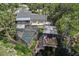 Aerial view of the property showcasing a screened pool, a boathouse, and a canal waterfront at 1108 Shockney Dr, Ormond Beach, FL 32174