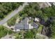 Aerial view of a beautiful home with a screened pool and dock along a serene canal at 1108 Shockney Dr, Ormond Beach, FL 32174