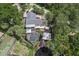 Aerial shot features a home with pool, boat dock, and lush tropical landscaping at 1108 Shockney Dr, Ormond Beach, FL 32174