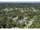 An elevated shot showcasing a beautiful home near lush trees and greenery at 1108 Shockney Dr, Ormond Beach, FL 32174