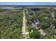 Wide-angle shot features a beautiful home with lush landscaping near a waterway at 1108 Shockney Dr, Ormond Beach, FL 32174