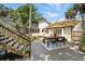 Relaxing outdoor deck with dining area, perfect for entertaining and enjoying the landscaped backyard at 1108 Shockney Dr, Ormond Beach, FL 32174