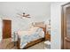 Inviting bedroom showcasing a ceiling fan, warm lighting, and a decorative wall mirror at 1108 Shockney Dr, Ormond Beach, FL 32174