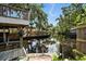 Waterfront dock with covered deck, lush landscaping and canal views, perfect for relaxing or entertaining at 1108 Shockney Dr, Ormond Beach, FL 32174