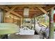 Covered boat dock features a porch swing with canal access, as well as room for kayaks and boating equipment at 1108 Shockney Dr, Ormond Beach, FL 32174