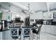 Open kitchen with granite counters, stainless appliances, bar seating and white cabinetry at 1108 Shockney Dr, Ormond Beach, FL 32174