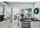 Bright kitchen featuring marble countertops, a wine cooler, and views into the dining area at 1108 Shockney Dr, Ormond Beach, FL 32174