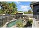 Beautiful screened-in pool area with a blue inflatable float and lush tropical landscaping at 1108 Shockney Dr, Ormond Beach, FL 32174