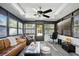 Sun room with comfortable seating, windows, and office space at 1108 Shockney Dr, Ormond Beach, FL 32174