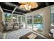 Bright sunroom with comfortable seating, backyard, and pool views at 1108 Shockney Dr, Ormond Beach, FL 32174
