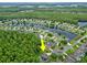 Aerial shot highlighting the property's location within a serene community near a lake at 1254 Royal Pointe Ln, Ormond Beach, FL 32174
