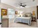 Cozy bedroom with a queen bed, dresser, and artwork creating a relaxing atmosphere at 1254 Royal Pointe Ln, Ormond Beach, FL 32174