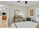 Bedroom showcasing a mirror, dresser with flowers, and seating area at 1254 Royal Pointe Ln, Ormond Beach, FL 32174