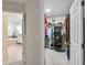 Walk-in closet filled with clothing and shoe organizers, with a view to the bathroom at 1254 Royal Pointe Ln, Ormond Beach, FL 32174