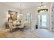 Inviting dining room featuring an oval table, neutral decor, and lots of natural light at 1254 Royal Pointe Ln, Ormond Beach, FL 32174